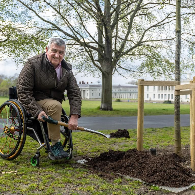 Gordon Perry plants a tree