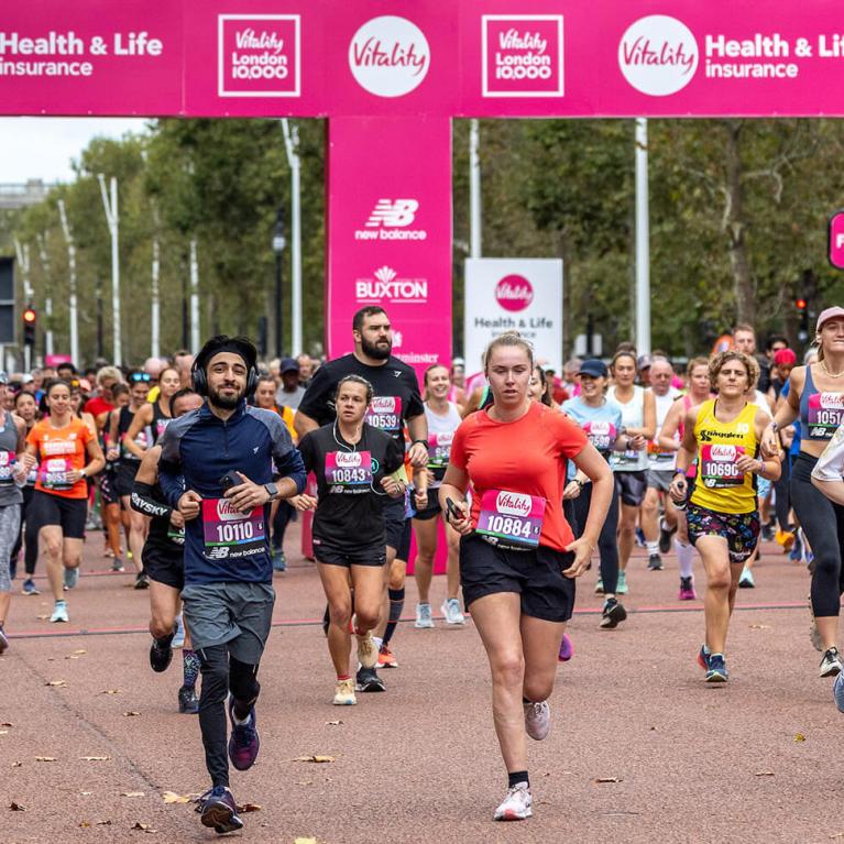 A mass of runners leave the Vitality London 10000 Start Line