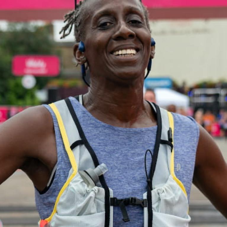 A 2021 Vitality Big Half runner is all smiles after completing the race