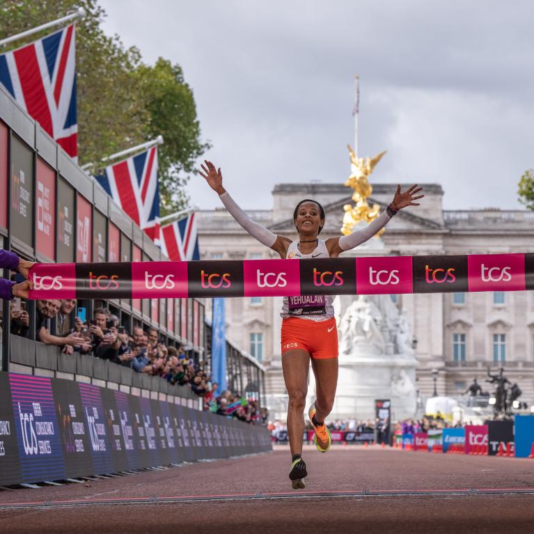 Yalemzerf Yehualaw cross the Finish Line of the 2022 TCS London Marathon