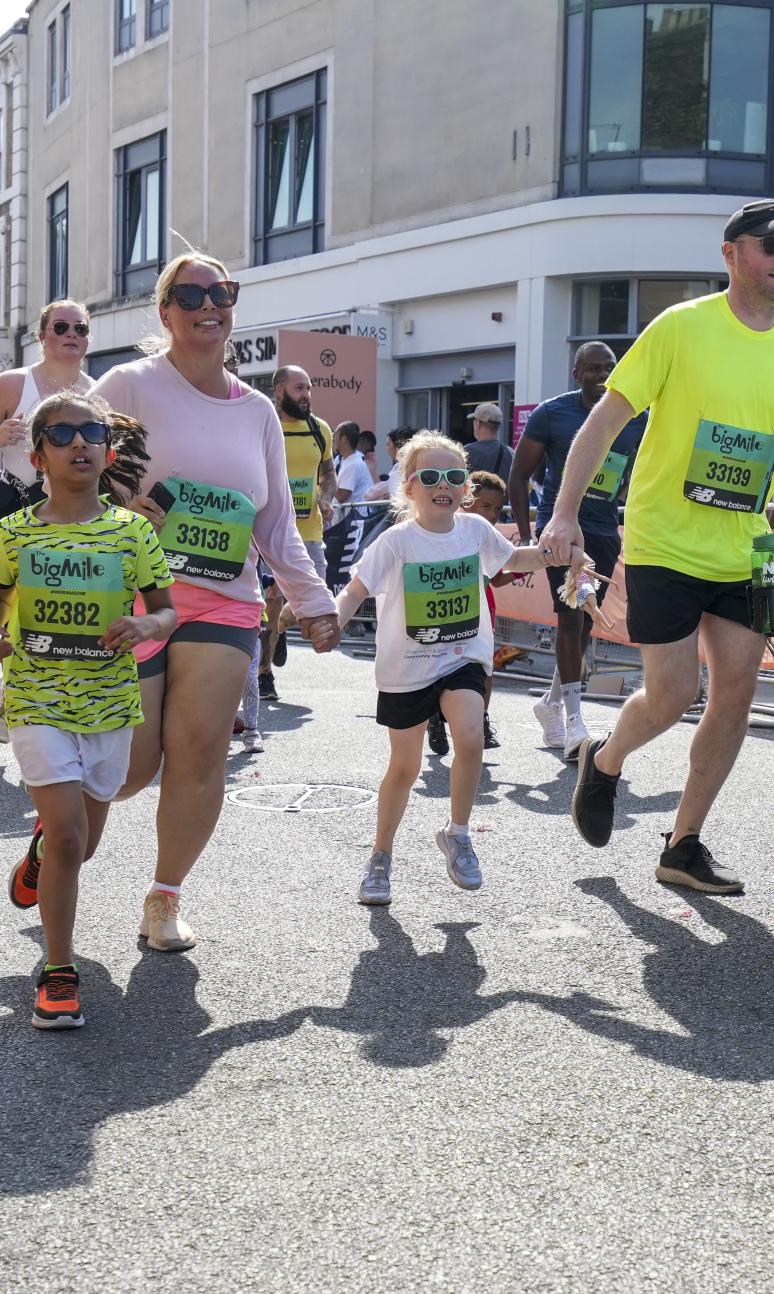 Families running together for The Big Mile race