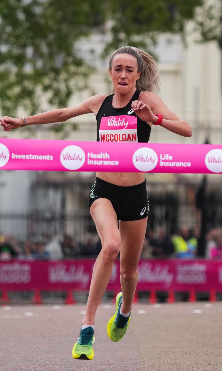 Women running towards a finish line