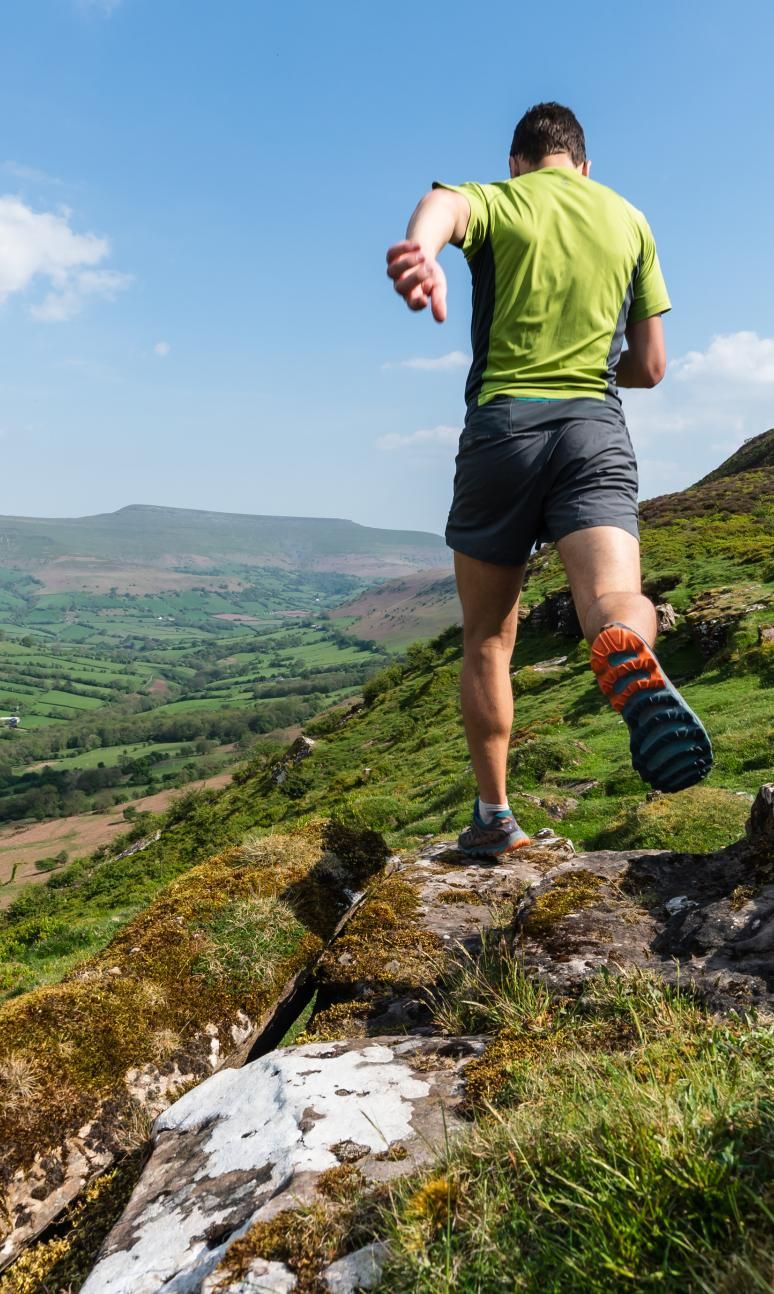 Man running through the Brecon Beacons