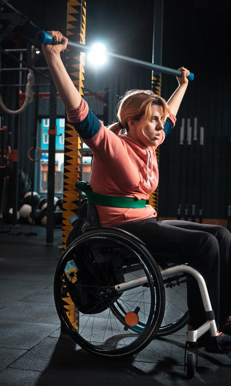 Wheelchair user enjoying an indoor gym session