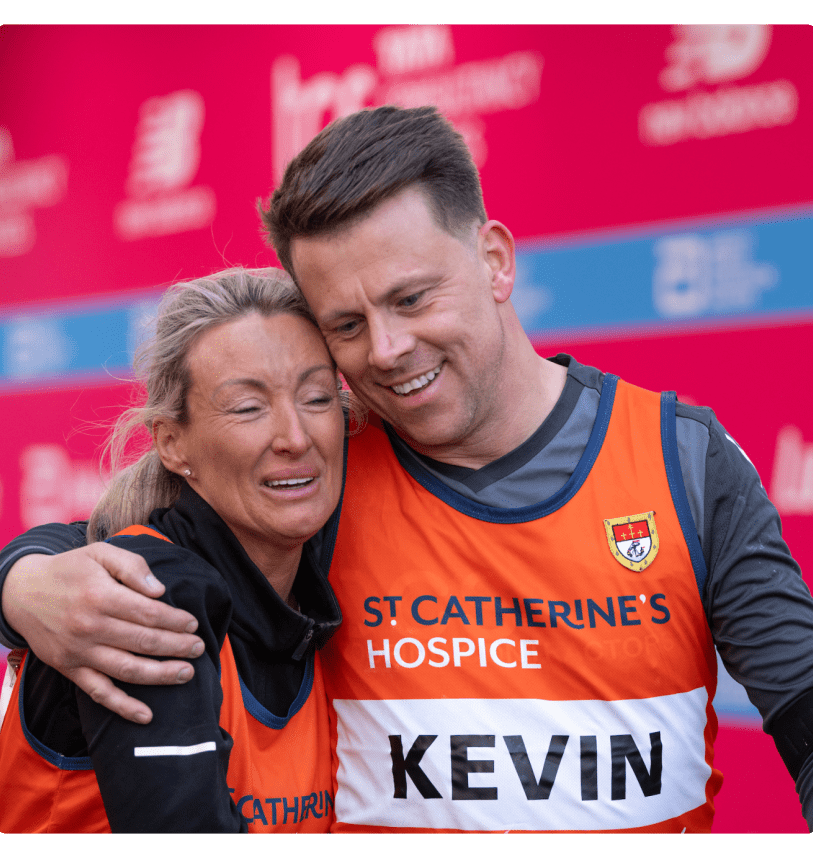 Two participants embrace on the Finish Line after their TCS London Marathon 