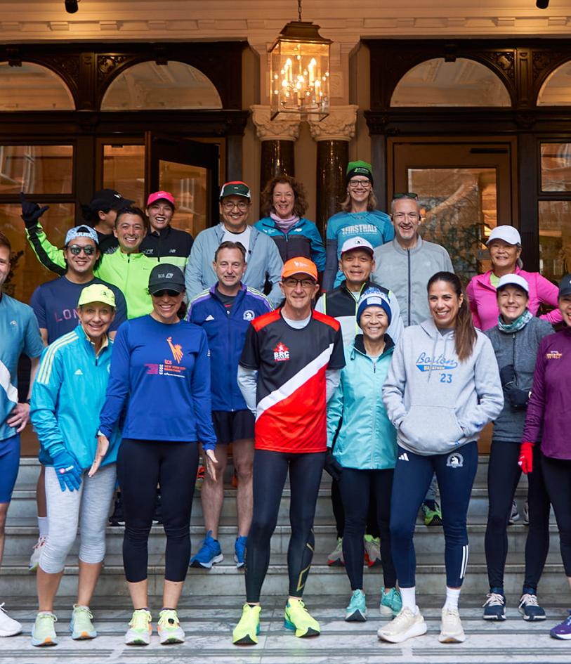 Marathon Tours & Travel runners pose for a group shoot