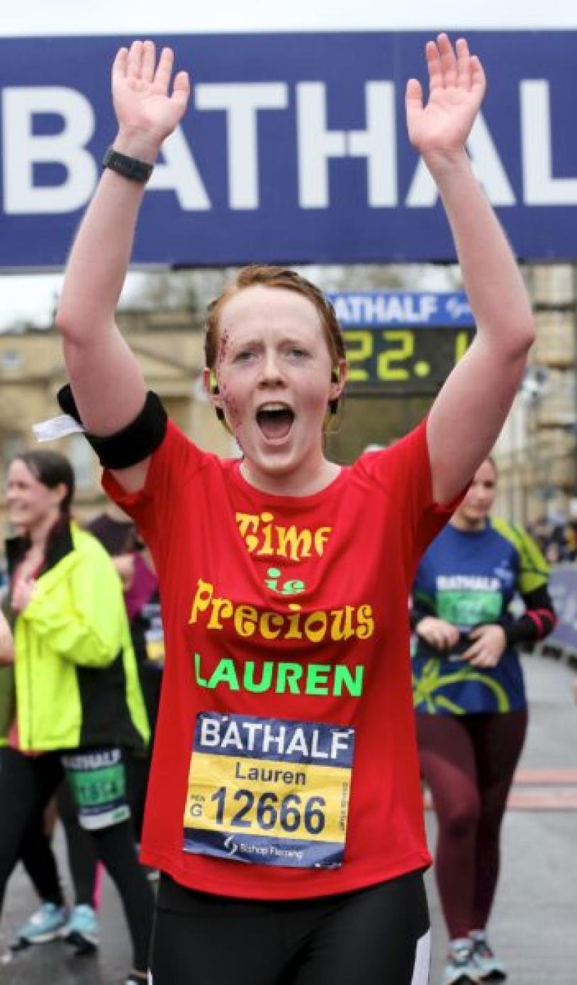 People finishing a half marathon