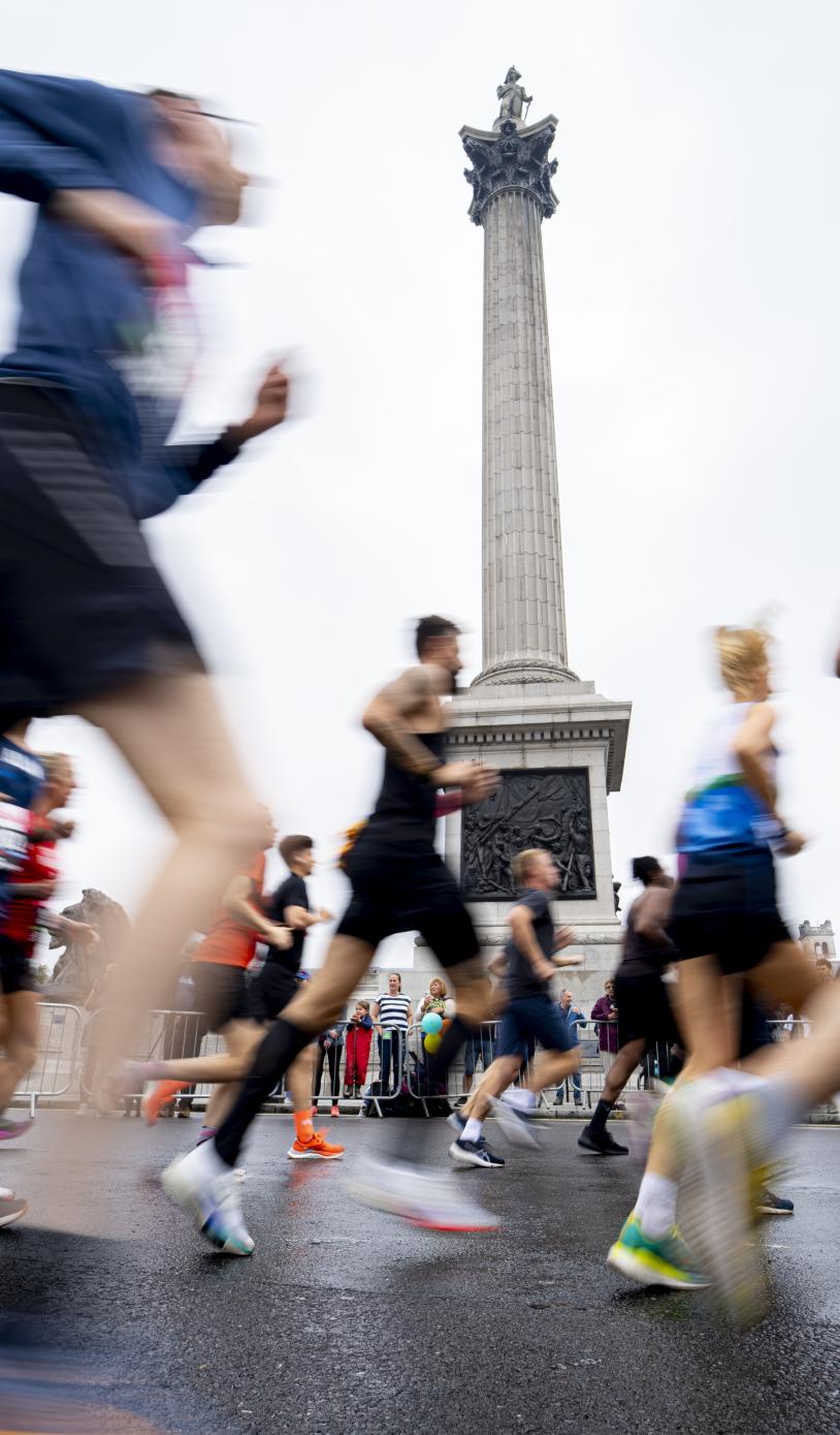 Vitality London 10,000 runners pass by Nelson's Column