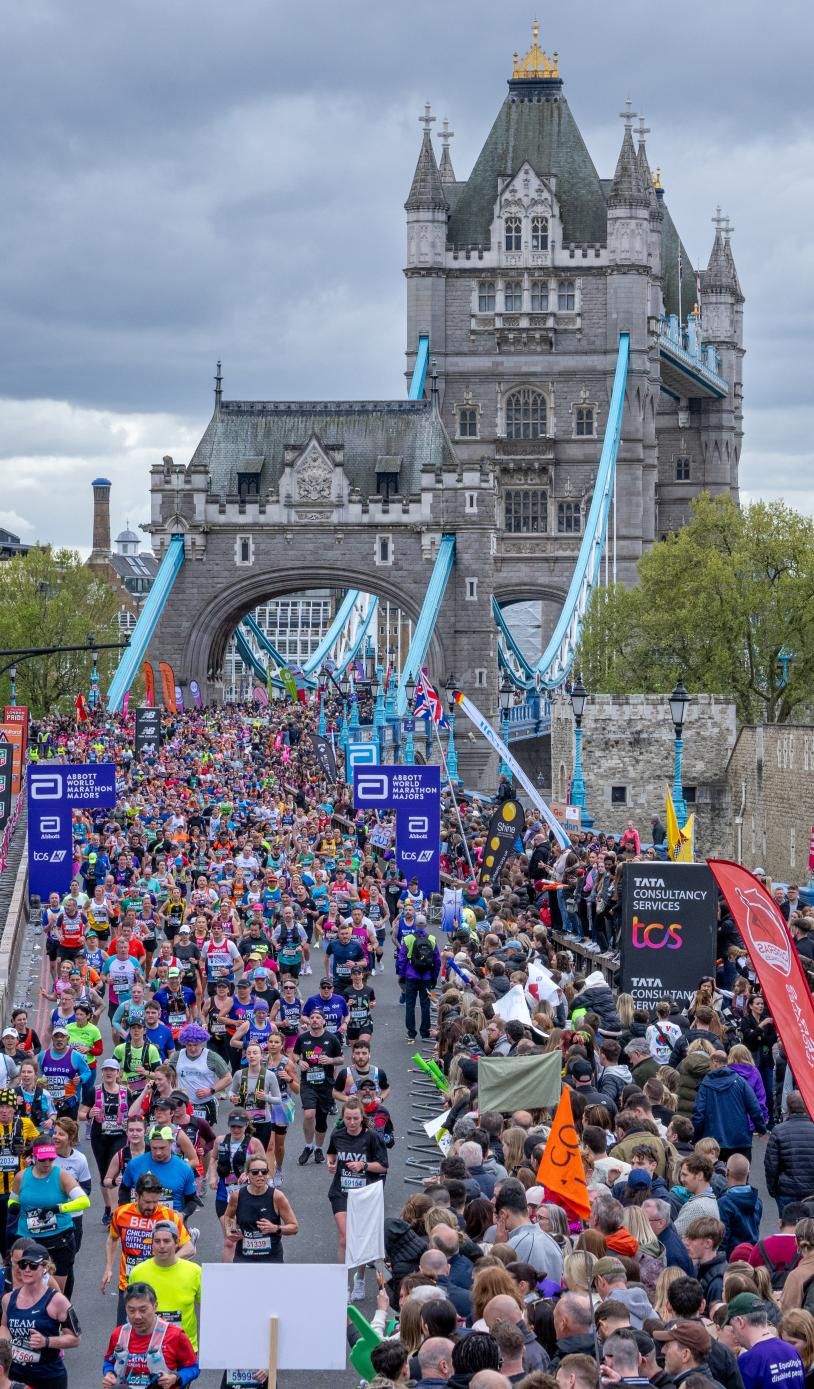 Runners cross Tower Bridge at the TCS London Marathon