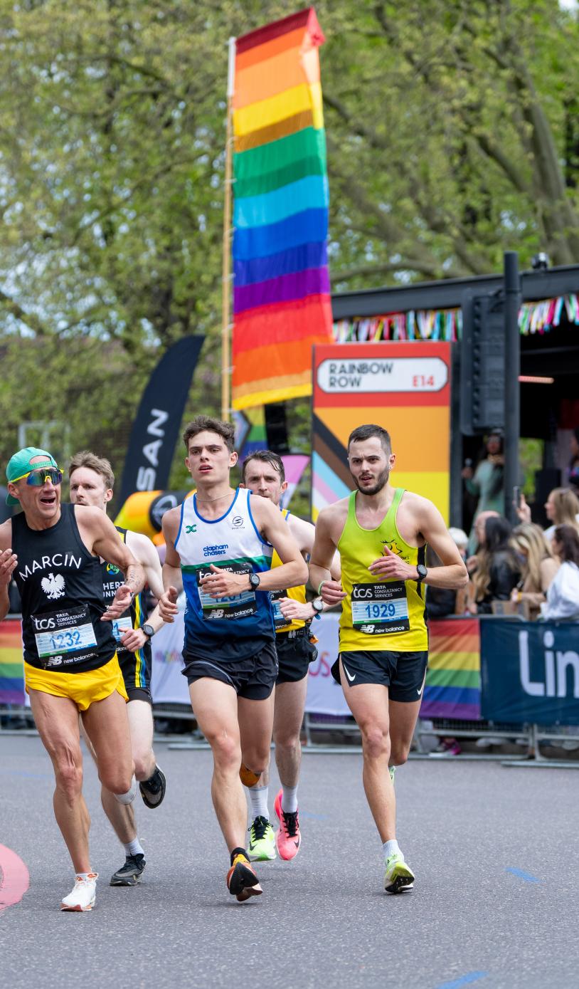 Runners pass through Rainbow Row 