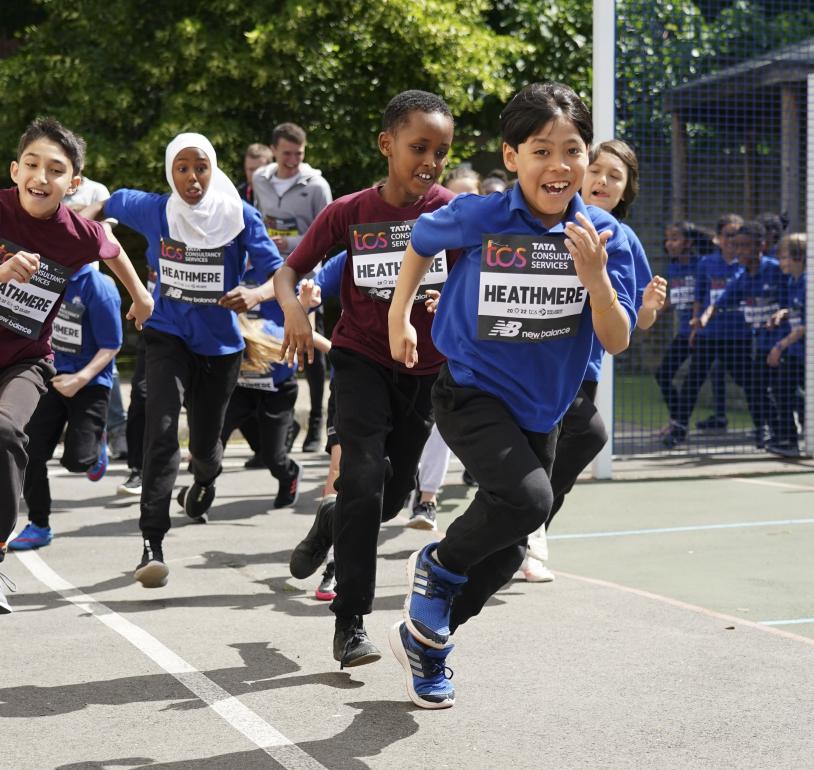 School children complete their mile in the playground