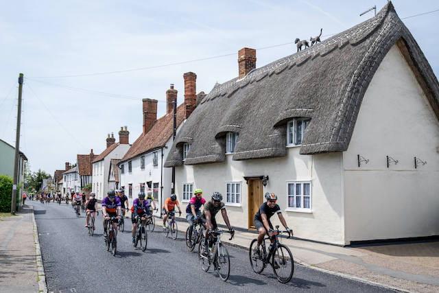 Cyclists going through Great Dunmow during Ford RideLondon 2024