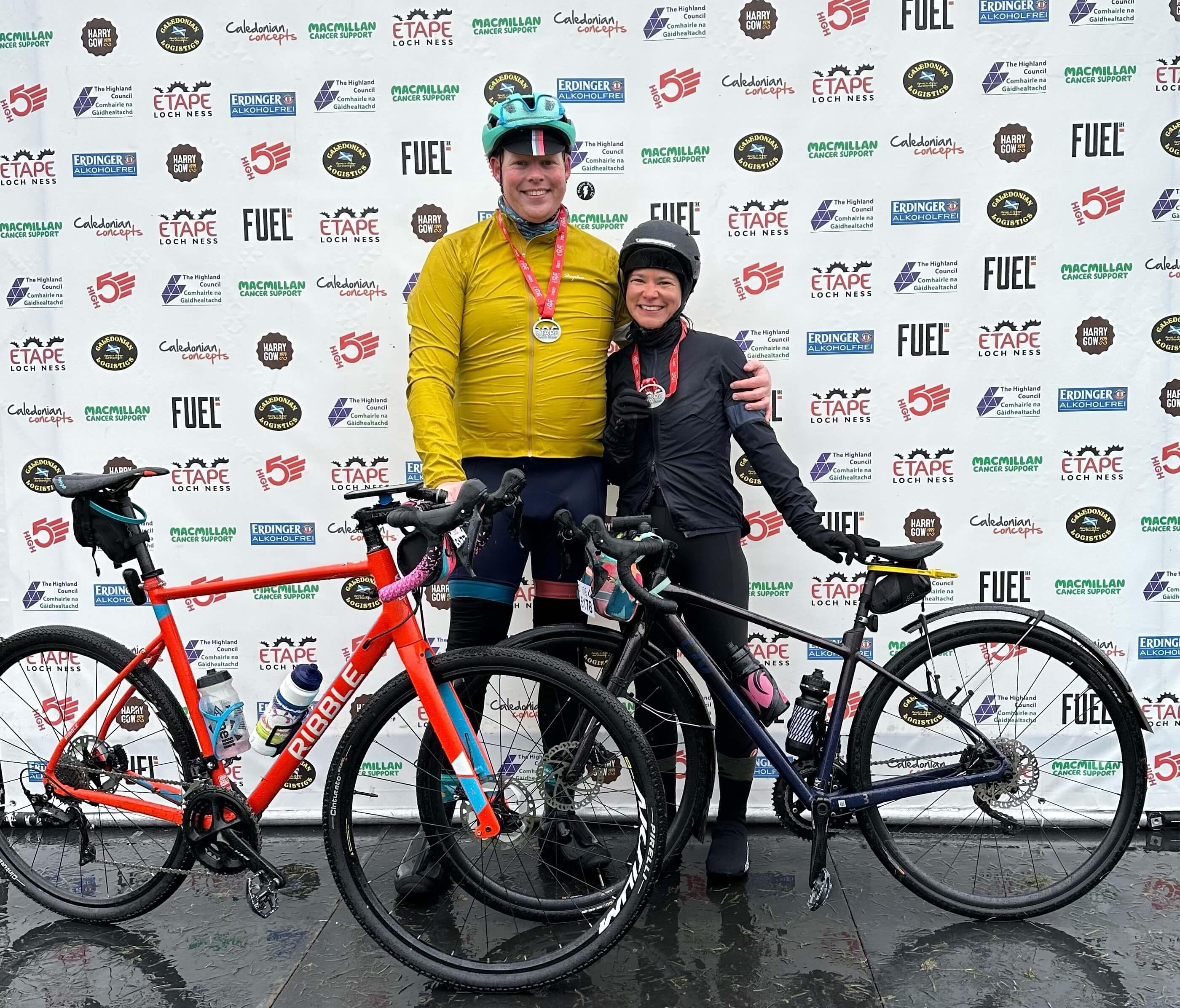 Two cyclists with their bikes