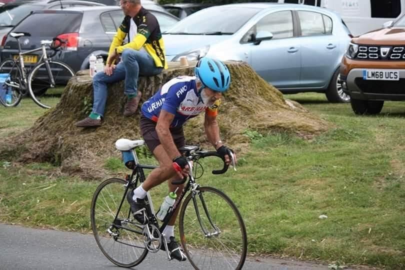 A cyclist riding along a road